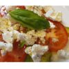 plate of freshly made tomato avocado with feta